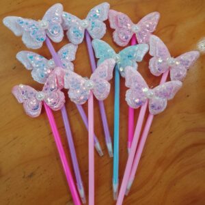 Lapicera mariposa con perla trazo azul